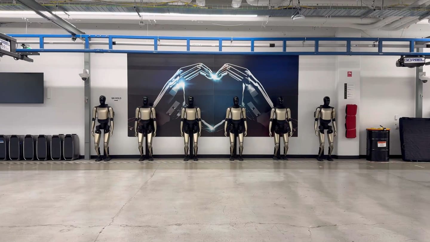 Tesla Optimus humanoid robots in lineup formation