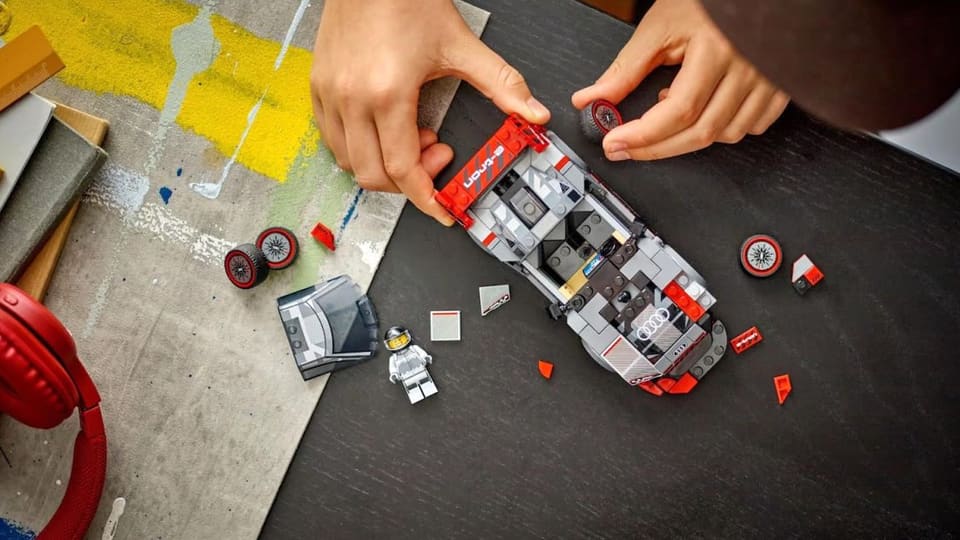 Assembled LEGO electric vehicle model kit on table