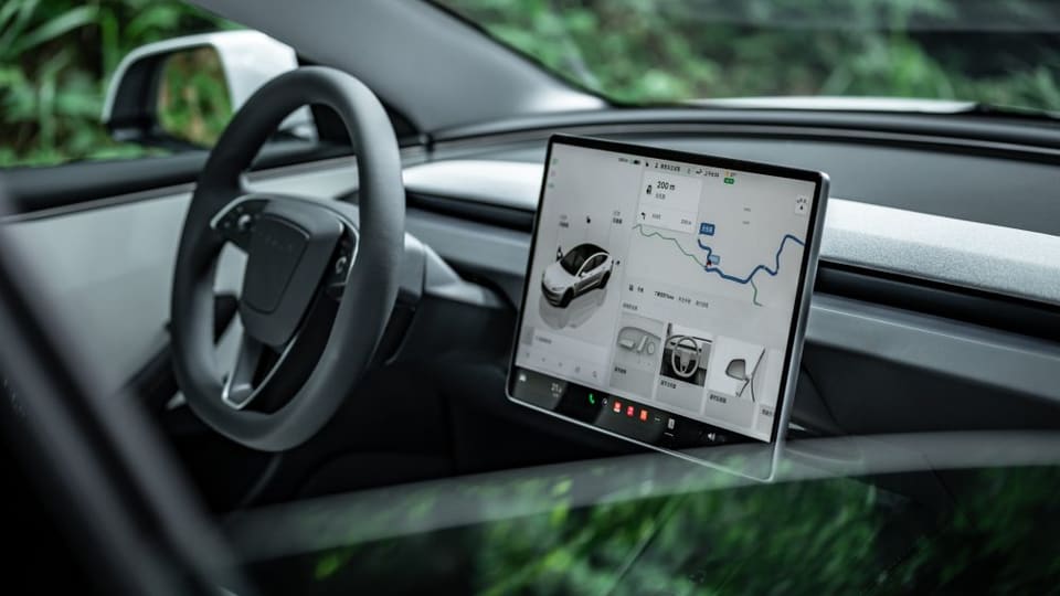 Tesla touchscreen displaying FSD navigation route