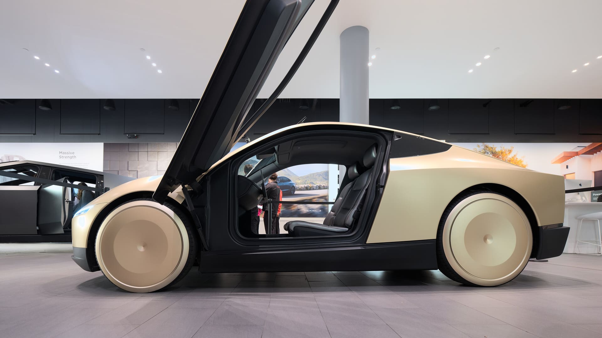 Side view of a Tesla Cybercab concept car on display at Santana Row