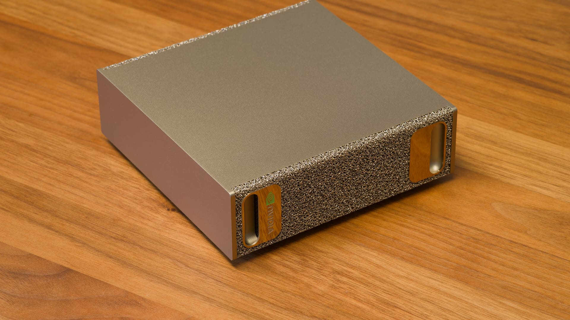 Oblique view of the compact gold Nvidia DGX Spark desktop AI computer