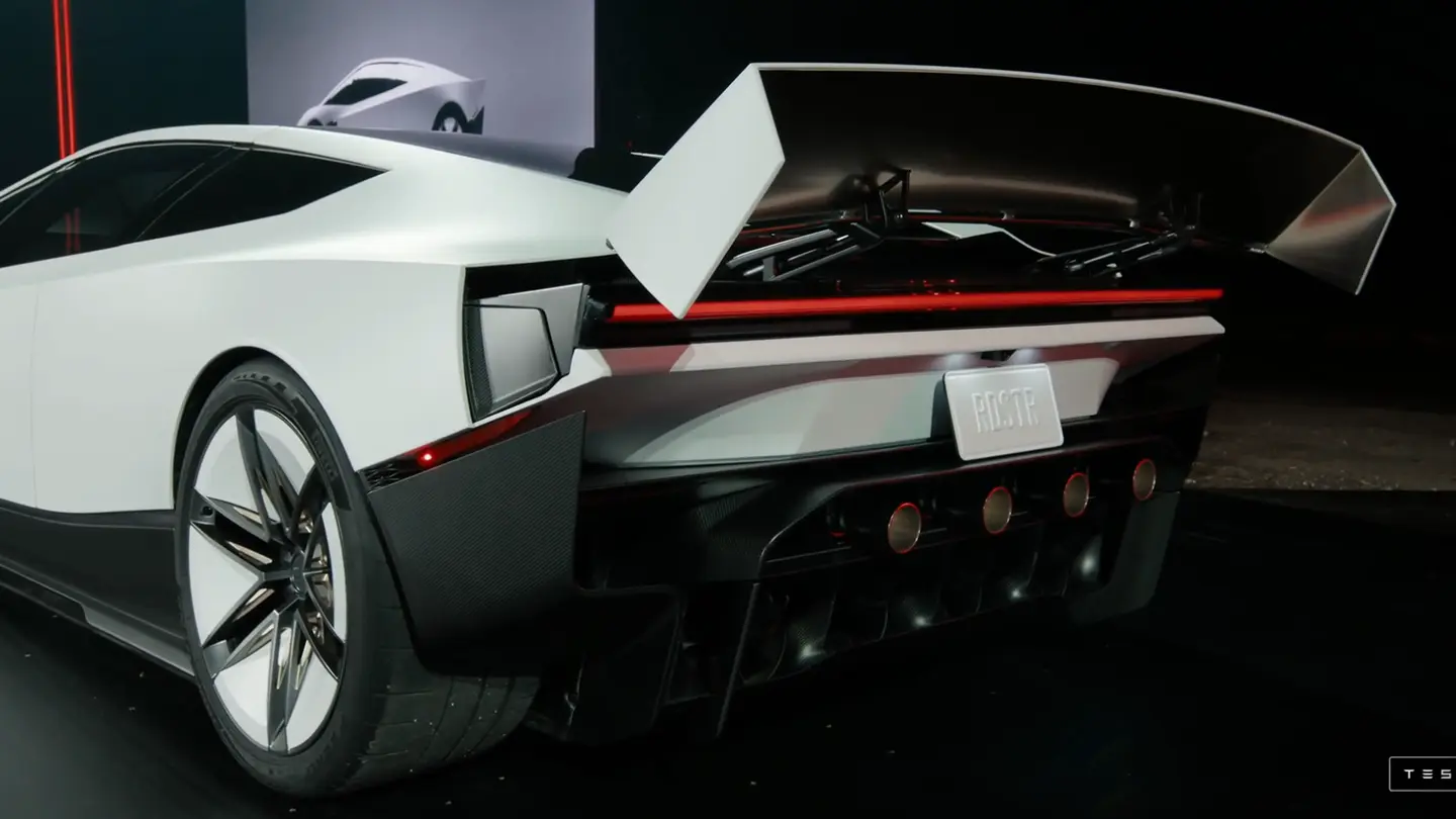 The back of the new Roadster with a large raised wing and four round nozzles under the bumper