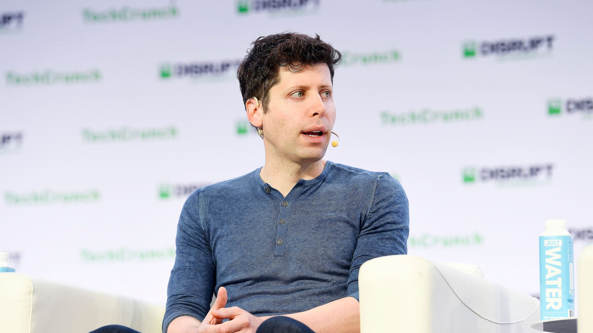 OpenAI CEO Sam Altman speaking onstage at TechCrunch Disrupt San Francisco 2019
