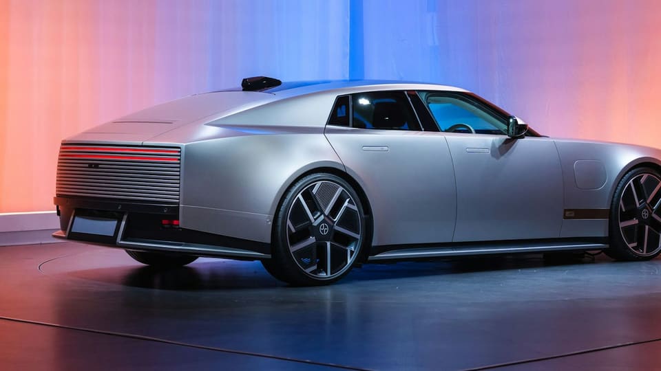 Rear view of the silver production Jaguar Type 01 four-door electric GT