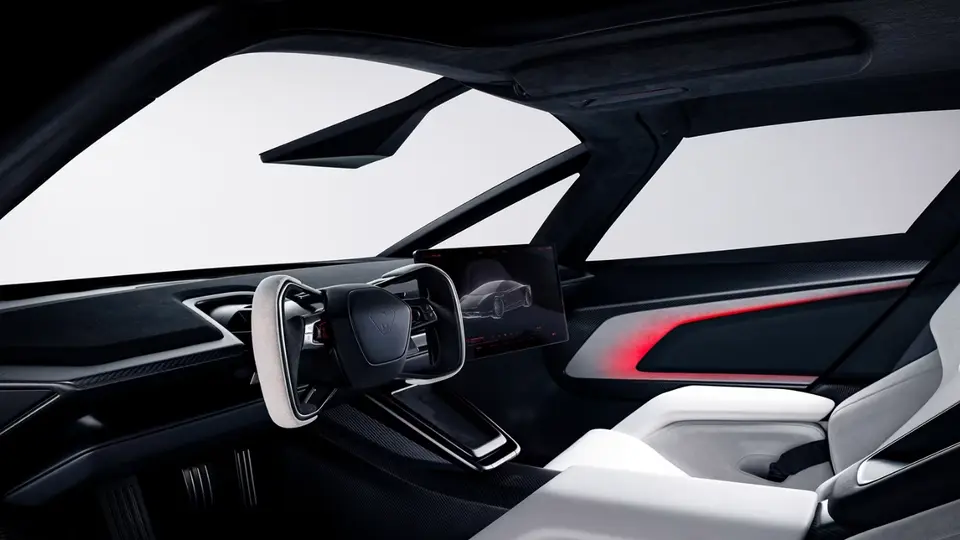 The Roadster cabin with a squared off steering yoke and a flat rectangular screen standing on the dash