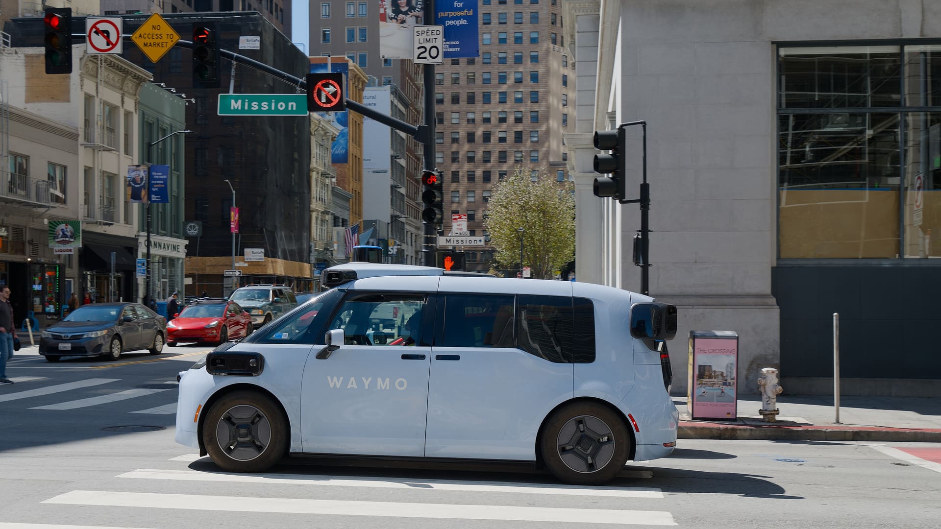 Waymo Ojai autonomous robotaxi on Mission Street in downtown San Francisco