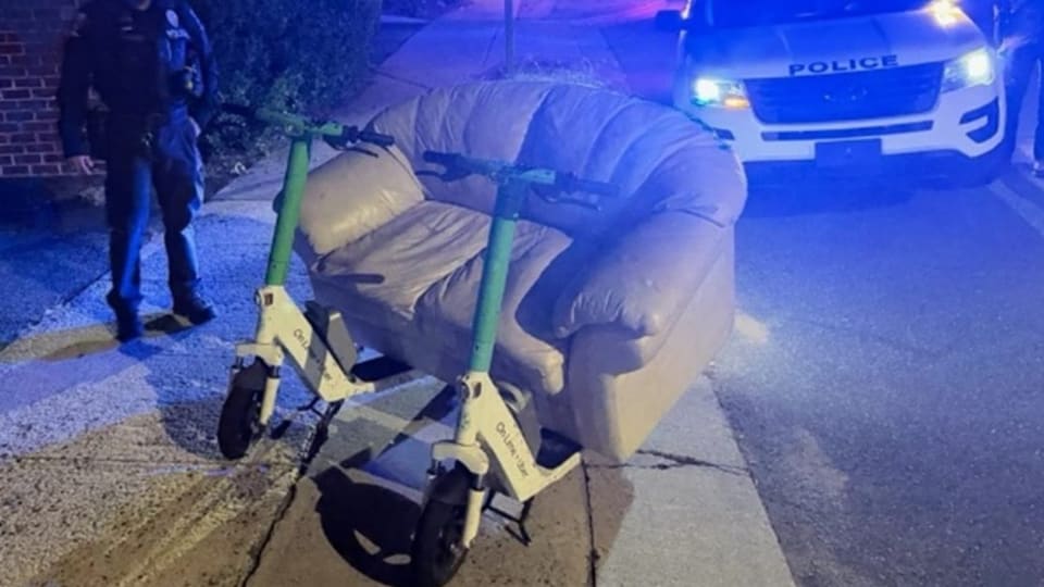 Police pull over two men riding electric couch on shared Lime scooters