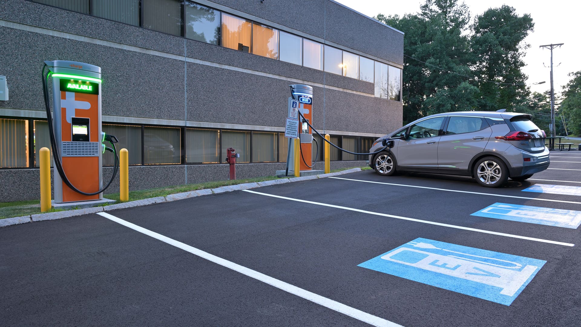 Gray Chevrolet Bolt EV charges at ChargePoint DC fast charging station in Billerica, MA