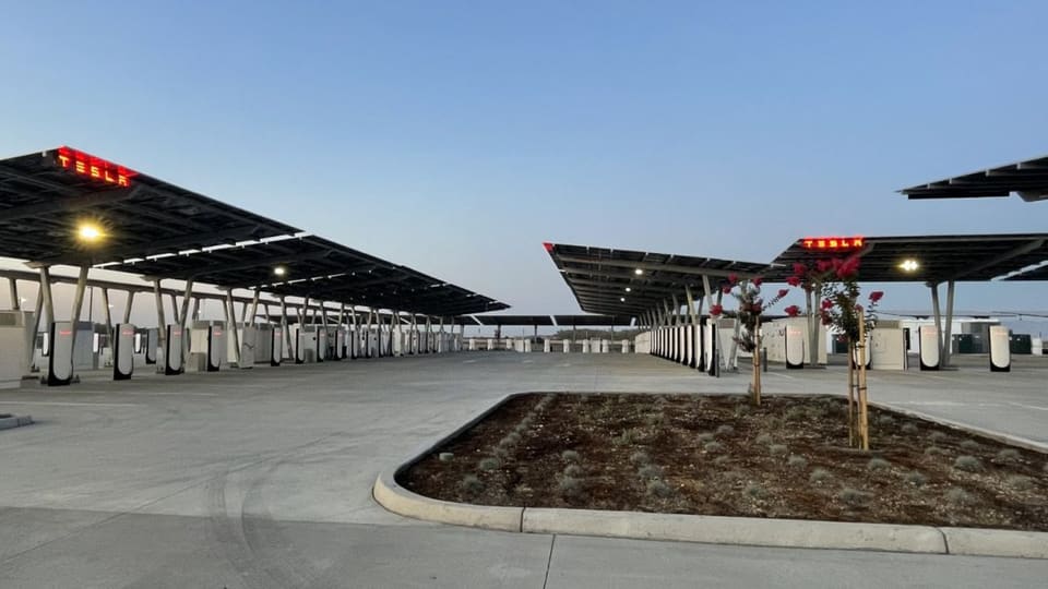 Row of Tesla Supercharger fast-charging stalls at Tesla's Oasis station in California
